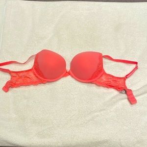 Woman’s pink Victoria’s Secret 34D bra